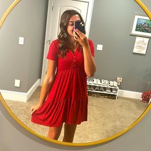 A red dress that is an XS made by Knox Rose.